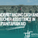 a man in crisis area providing humanitarian aid through cash and voucher assistance to the people in need